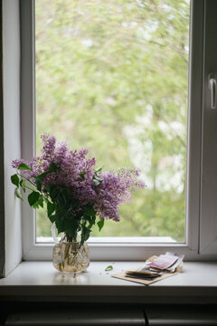 bouquet of lilacs on the window
