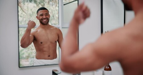 Man, mirror and muscle flex in bathroom for fitness results with towel, skincare and confidence for progress in home. Male person, reflection and strong body for exercise, dermatology and wellness