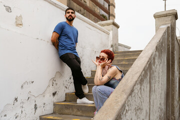 Modern Couple Posing on Graffiti Steps
