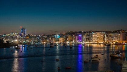 Beautiful night cityscape and coast in Sliema, Malta