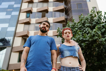 Fashionable Couple Posing Against Buildings