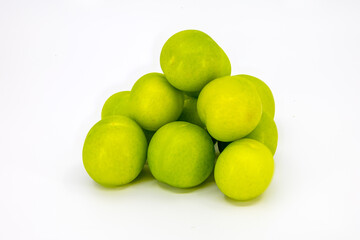 Stack of Fresh Green Plums on White Background