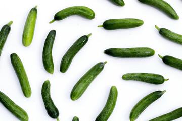 Mini cucumbers on white background.