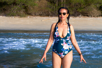 Woman body pretty with swimsuit relax at beach