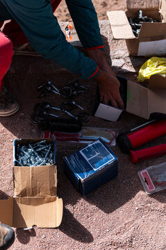 Climber organize bolting equipment, weekend adventure