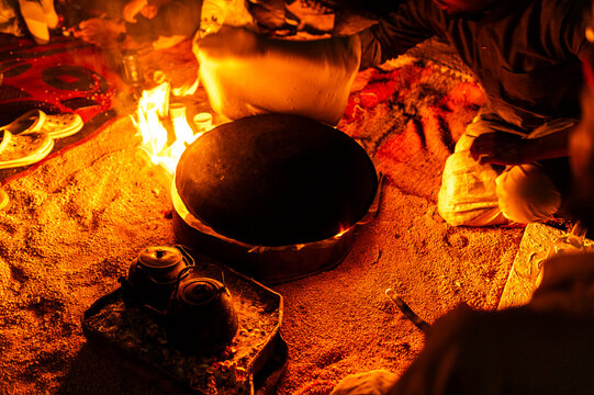 Traditional bread baking over campfire, outdoor experience