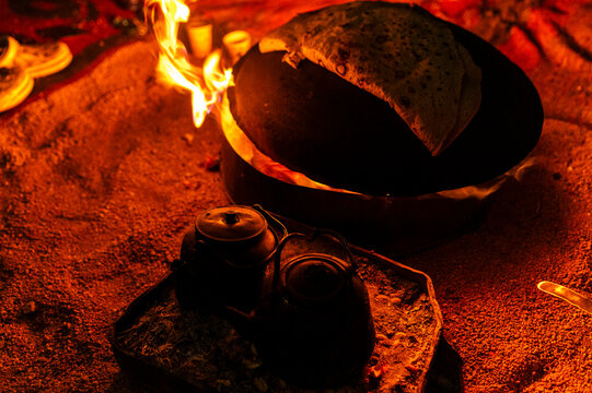 Traditional bread baking over campfire, outdoor experience