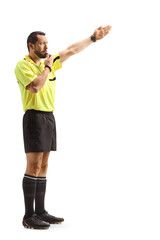 Football referee blowing a whistle and showing offside