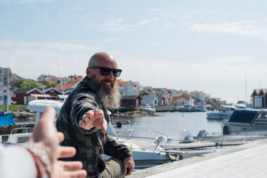 trying to shake hands with a man 