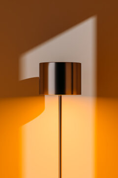 Shadow of modern lamp on warm interior wall