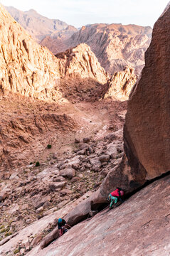 Rock climber climbing a crack