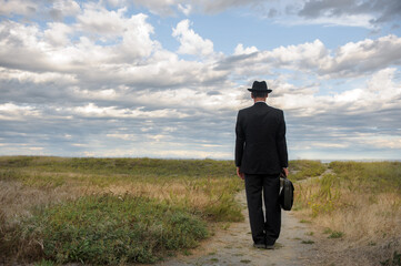 Businessman standing on a path