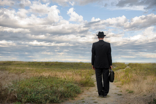 Businessman standing on a path