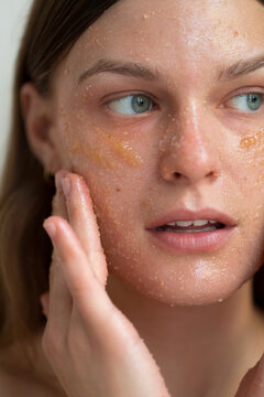 Applying face scrub