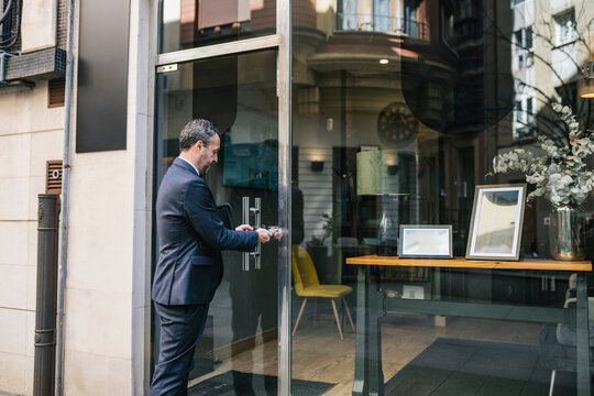 Businessman Entering Real Estate Office