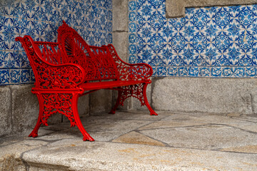 Typical Portuguese red bench with Azulejos
