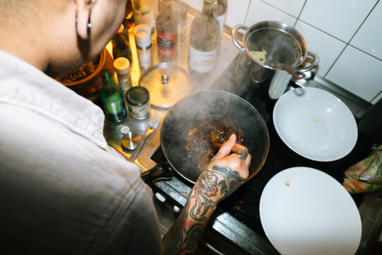 Tattooed Chef Cooking Meal