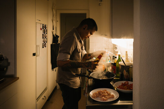 Man Cooking Dinner at Home