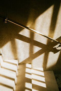 Sunlit Staircase with Dramatic Shadows
