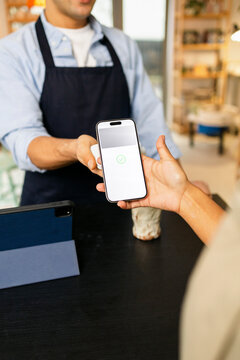 Close-Up Phone Payment Process at shop