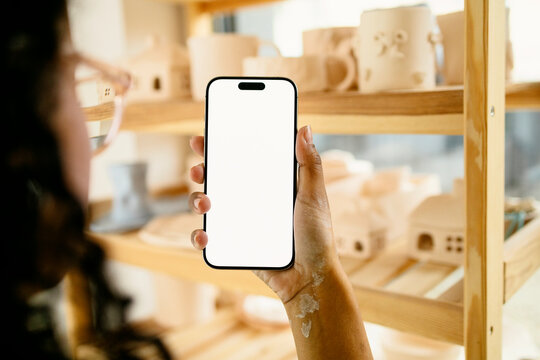 Woman Hand Holding Smartphone with Blank Screen