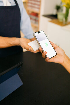 Close-Up Phone Payment Process at shop