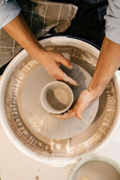 Close-up Hands Molding Clay on Spinning Wheel
