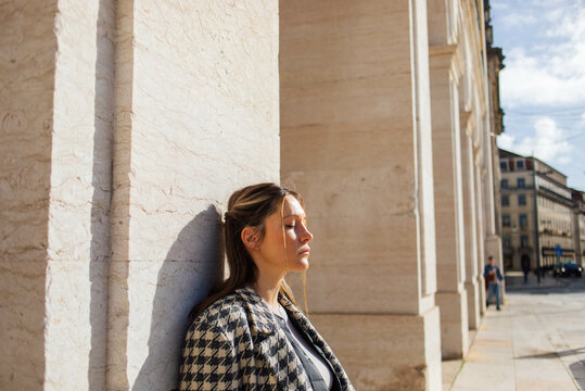 Portrait of a young woman soaks up the sun
