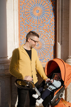 Father and his young son together in an urban area