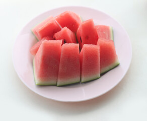 Watermelon in plate on white table