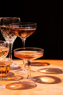 Coupes and stemware with ros&eacute; wine