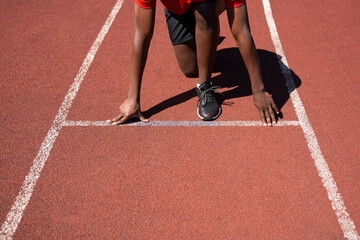 Close Up Of Runner Prepared For Start