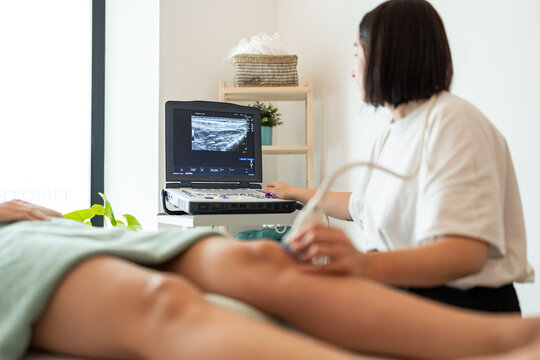 Physiotherapist performing an ultrasound.