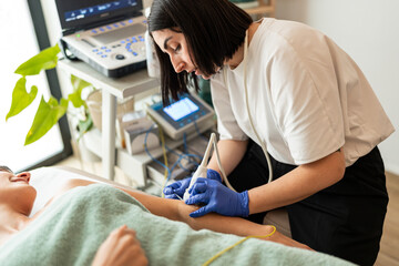 Ultrasound in physiotherapy session.