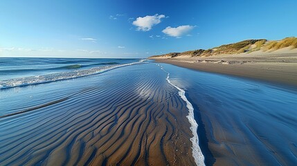 Sandy beach with tidal patterns and rippling waves, capturing the essence of coastal scenery. , Minimalism,