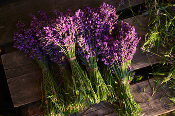 Fresh flowers of lavender bouquet on a white wooden background