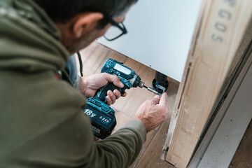 Crop man working with drill