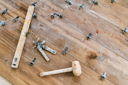 Various tools for workbench on wooden surface