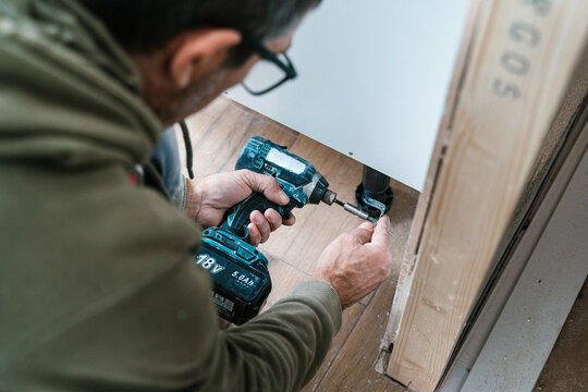 Crop man working with drill