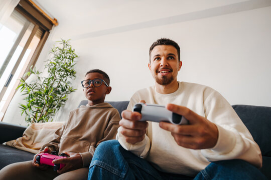 Father and son playing video games