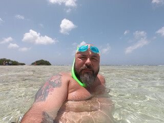 Man taking selfie picture at beach summer vacation