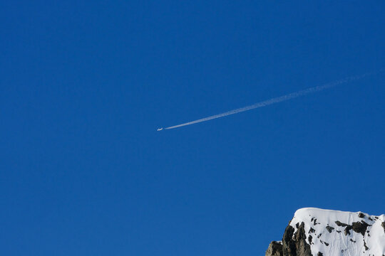Plane in the blue sky.