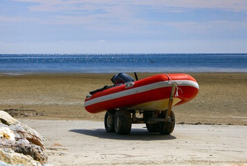 inflatable rescue boat at the beach on standby.