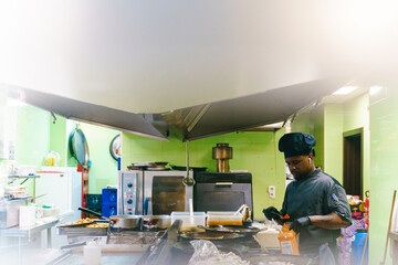  Chef Preparing Food in Busy Kitchen