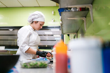Focused Chef in White Uniform