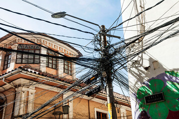 light pole in a corner with tangled wires
