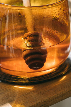Honey spoon in a cup