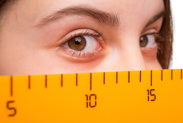 Math and mathematics. Education and knowledge. Girl student eye with ruler. Time to study....