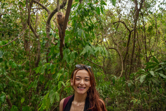 Woman being watched by a monkey