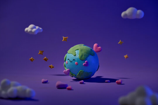 planet with clouds, hearts and stars around it